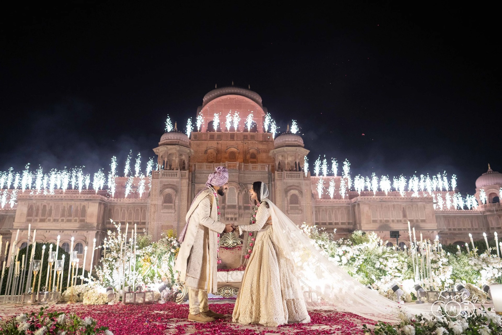 Wedding celebration beneath palace arches